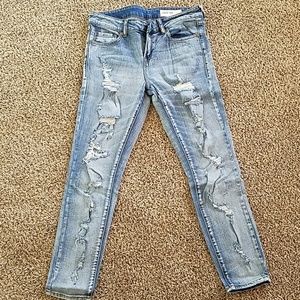 Holey light wash skinny jeans